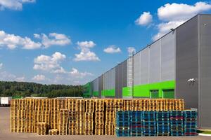 Wooden pallets heap in the cargo warehouse photo