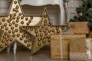 Photo of luxury gift boxes under Christmas tree