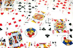 a pile of playing cards on a table photo