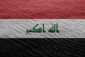 bandera de república de Irak en un texturizado antecedentes. concepto collage. foto