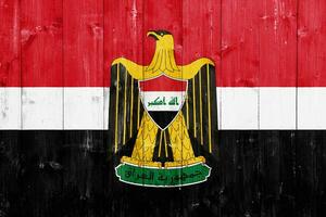 Flag and coat of arms of Republic of Iraq on a textured background. Concept collage. photo
