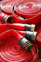 a close up of a red fire hose photo