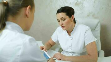 Female cosmeticians having a professional conversation video