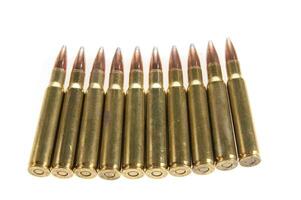 a row of bullet cartridges on a white background photo