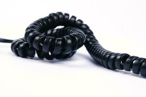 a black cord with a white background photo