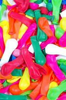 a pile of colorful plastic balloons photo