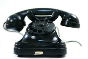 a black telephone on a white background photo