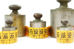 old weights for scales and tape measure to control the diet photo