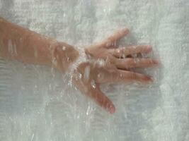 a person's hand is wet photo