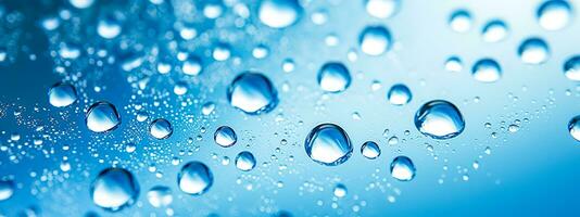 transparent water drops in the air, blue banner as background photo