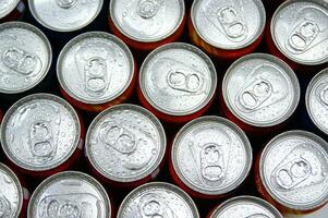 a close up of cans of soda photo