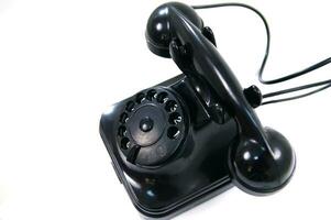 a black telephone on a white background photo
