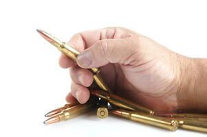 a row of bullet cartridges on a white background photo