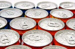 a close up of cans of soda photo