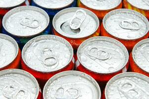 a close up of cans of soda photo