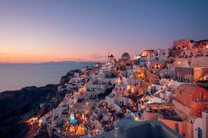 Amazing evening view of Santorini island. Panorama of summer sunset landscape at the famous destination Oia, Greece. Travel concept background. Fantastic Summer vacation or holiday, evening view photo
