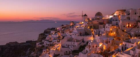 Amazing evening view of Santorini island. Panorama of summer sunset landscape at the famous destination Oia, Greece. Travel concept background. Fantastic Summer vacation or holiday, evening view photo