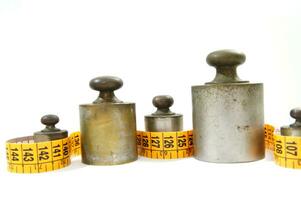 old weights for scales and tape measure to control the diet photo