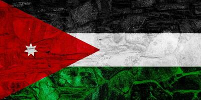 Flag of Hashemite Kingdom of Jordan on a textured background. Concept collage. photo