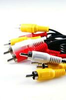 several different colored cables with different colored plugs photo