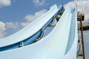 a blue slide in a water park photo