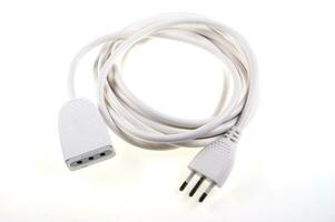 a white cable with two plugs on a white surface photo