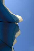 a blue and white striped umbrella photo