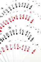 a pile of playing cards on a table photo