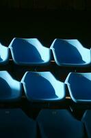 a row of blue chairs photo