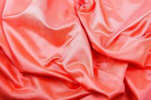 a close up of a bright pink satin fabric photo