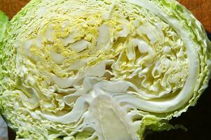 a close up of a cabbage with a knife photo