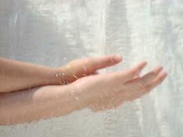 a person's hand is wet photo