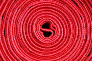 a close up of a red fire hose photo