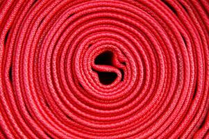 a close up of a red fire hose photo