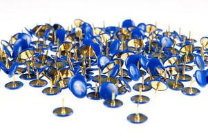 a pile of blue and gold buttons photo
