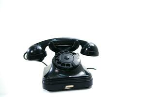 a black telephone on a white background photo