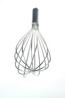 a black and silver whisk with a spiral shape photo