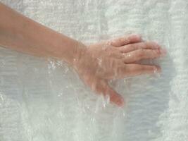 a person's hand is wet photo