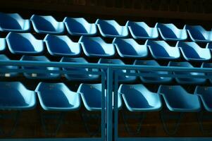 a row of blue chairs photo