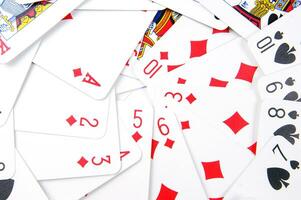 a pile of playing cards on a table photo