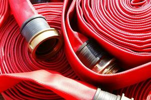 a close up of a red fire hose photo