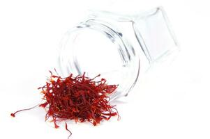 a pile of red saffron on a white background photo