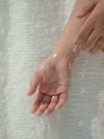 a person's hand is wet photo