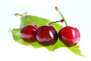 a close up of a bowl of cherries photo