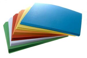 a stack of colored paper with a white background photo