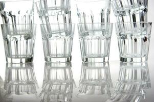 a stack of empty glasses on a table photo