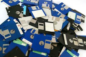 a pile of floppy disks photo