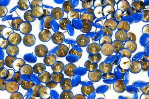 a pile of blue and gold buttons photo