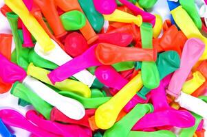 a pile of colorful plastic balloons photo