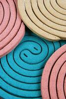 a group of colorful coasters with a spiral design photo